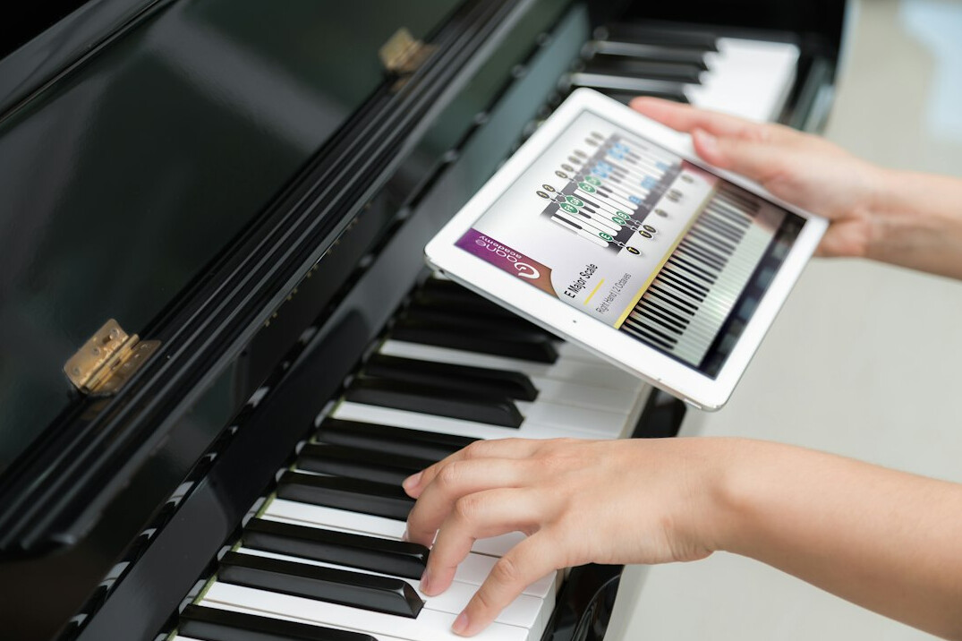 Hands reviewing performance charts on a tablet